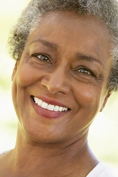 woman with dental implants smiling