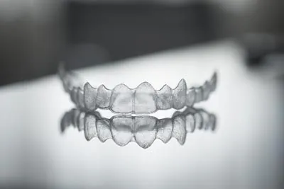 closeup of clear aligners offered at Strawberry Village Dentist